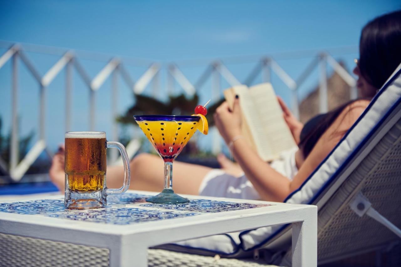 Hotel Luxury Patio Azul (Adults Only) Puerto Vallarta Eksteriør bilde A woman reading a book by the pool